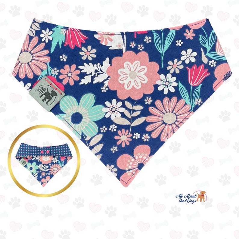 May include: A navy blue dog bandana with a floral pattern in pink, white, and teal. The bandana has a tag with a dog silhouette. A smaller, reversible bandana is shown in a gold circle. The text "All About the Dogs" is at the bottom.