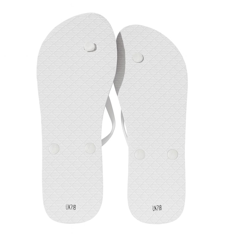 May include: A pair of white flip-flops featuring a textured diamond pattern on the footbed, a thong-style strap, and the text UK7/8 printed in black near the heel area of each sandal, indicating the size on the sole of the footwear.