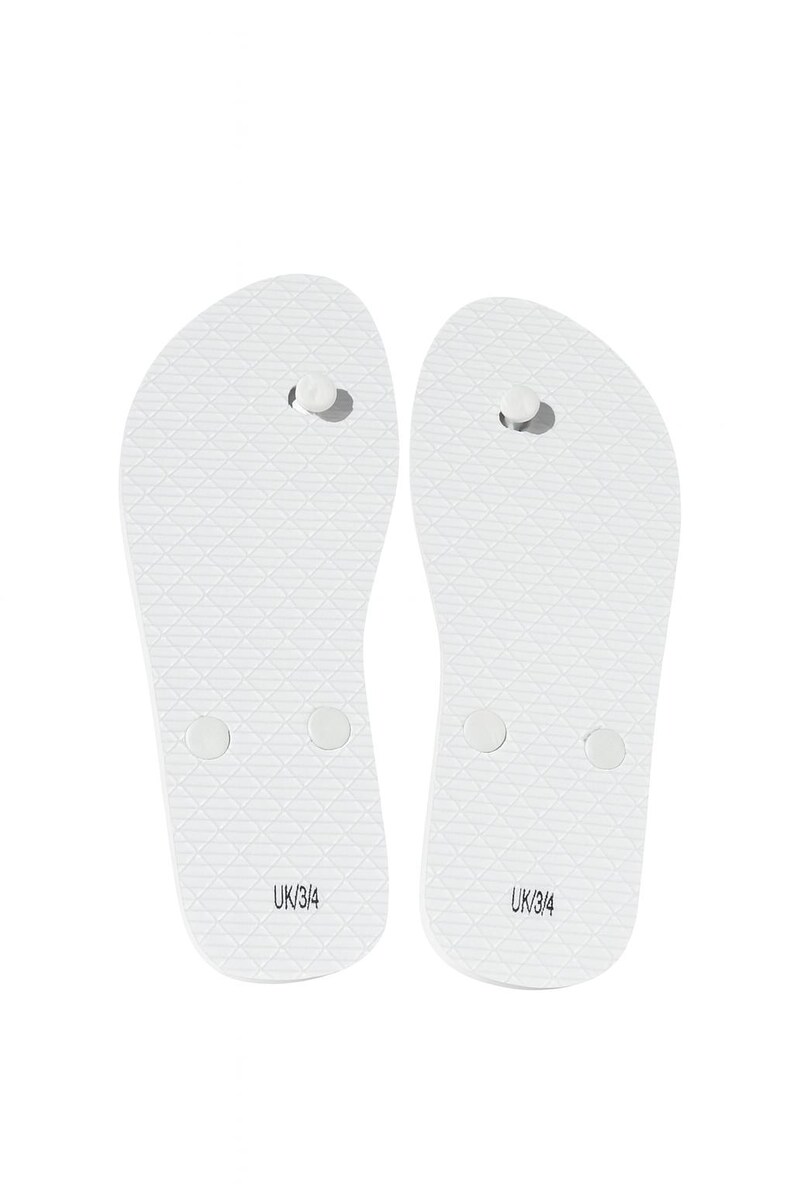 May include: A pair of plain white flip-flops featuring a textured diamond pattern on the footbed and a central toe post. The heel area of each sandal is clearly printed with the text UK/3/4, indicating the size for these white rubber sandals.