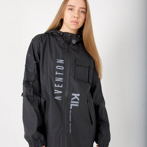 May include: Black hooded jacket with a zipper closure and two large pockets. The jacket has the text "KIL" and "AVENTON" printed vertically on the front.