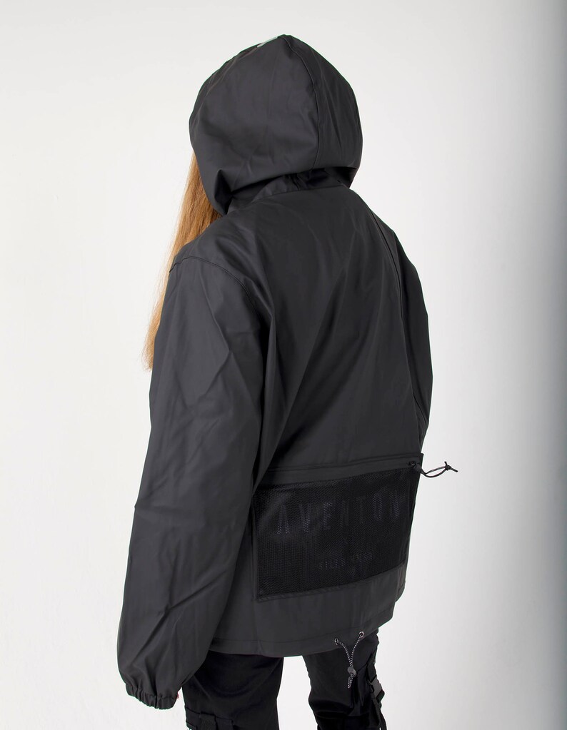 May include: Black hooded jacket with a mesh pocket on the back featuring the text "AVE ANTONY" in white.