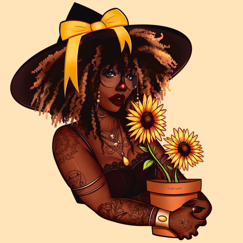 May include: A woman with dark brown curly hair wearing a black witch hat with a yellow bow and a black dress. She has a tattoo on her arm and is holding a pot with sunflowers.