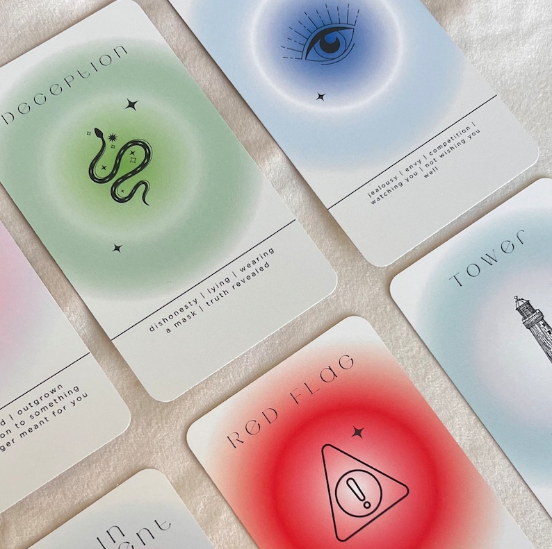 May include: A set of tarot cards with colorful backgrounds and illustrations. The cards feature the words "Deception", "Red Flag", "Tower", and "Intuition".
