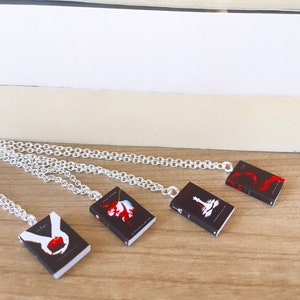 Saga book charm necklaces