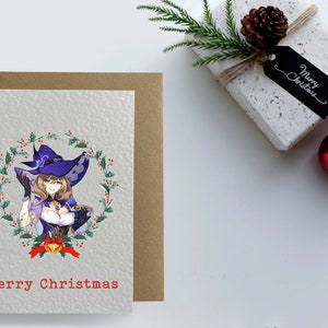 May include: A Christmas card featuring a woman with long brown hair wearing a purple and black witch hat and a white dress with a purple bodice. She is surrounded by a wreath of holly and berries. The card reads "Merry Christmas".