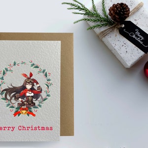 May include: A Christmas card featuring an anime-style woman in a red and brown outfit standing in a wreath of holly with red berries. The text "Merry Christmas" is printed in red at the bottom of the card.