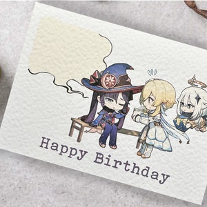 May include: A birthday card with a cartoon illustration of three characters. The character on the left is wearing a purple and blue outfit and a witch's hat. The character in the middle is wearing a white dress and has blonde hair. The character on the right is wearing a white dress and has white hair. The card says "Happy Birthday".