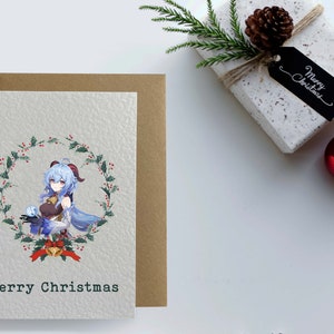 May include: A Christmas card featuring a cartoon character with blue hair holding a snowball in a wreath of holly. The card reads "Merry Christmas".