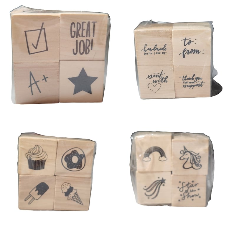 May include: Set of 12 wooden stamps with various designs, including a star, a checkmark, a cupcake, a donut, a rainbow, a unicorn, and text like "Great Job!" and "Handmade with Love By:".