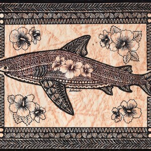 May include: A black and white illustration of a shark with hibiscus flowers on a tan background. The shark is surrounded by a black border with a repeating pattern.