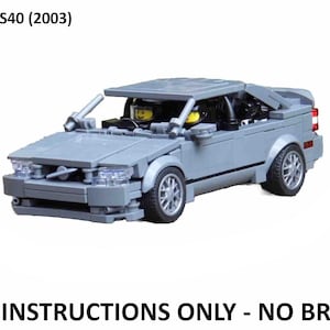 May include: A grey Lego model of a Volvo S40 (2003) car with two Lego minifigures inside. The car has a black interior and black wheels. The model is made of Lego bricks and is a detailed replica of the real car. PDF instructions only - no bricks.