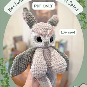 May include: A handmade crochet owl plushie in shades of gray and pink. The owl has large black eyes and a fluffy texture. Text on the image reads "Nocturna The Nocturnal Forest Spirit", "PDF ONLY", and "Low sew!"