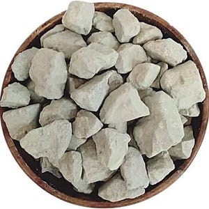 May include: A wooden bowl filled with numerous light grey, irregularly shaped rocks. The rocks have a rough texture and vary in size. The bowl has a dark brown rim and a light brown interior. The rocks appear to be a natural product.