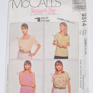 May include: McCall's Woman's Day Collection sewing pattern envelope. The envelope features four top designs, including a square-neck top, a V-neck top, a striped tank top, and a floral print top. The size is GW(22,24,26).