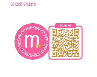 May include: Pink and white round sticker with the text "mariana Print studio-mariana Print studio-mariana Print studio-mariana Print studio" and the letter "m" in the center. A square sticker with the text "SCAN ME" and a QR code is to the right of the round sticker.