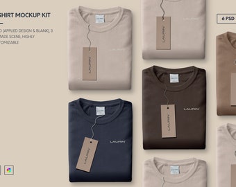 May include: Six folded t-shirts with brown paper tags that say "LAURIN" hanging from them. The t-shirts are in various colors, including beige, brown, and navy blue.