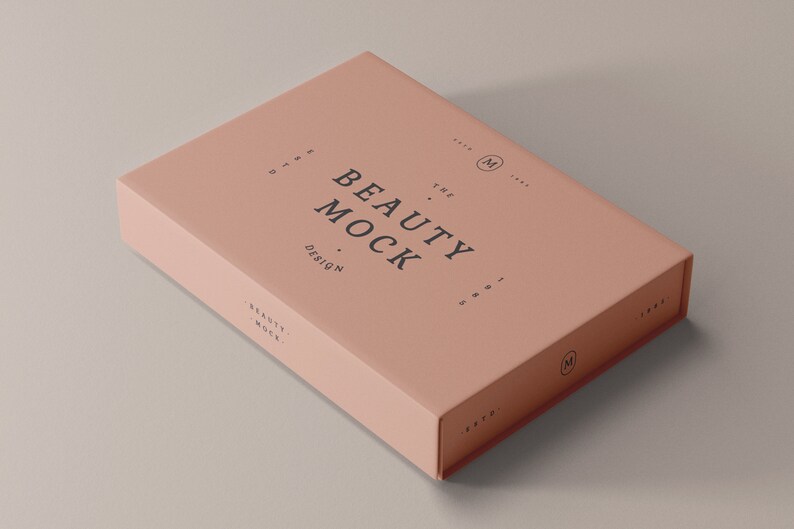 May include: A pale pink box with the text "THE BEAUTY MOCK DESIGN" printed on the top. The box is a mockup for a beauty product.