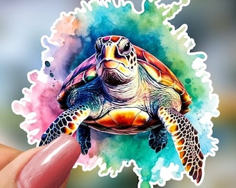 May include: A colorful sticker featuring a sea turtle with a watercolor effect. The turtle has a detailed shell with shades of brown, orange, and green. The background is a splash of blue, pink, and green watercolor.
