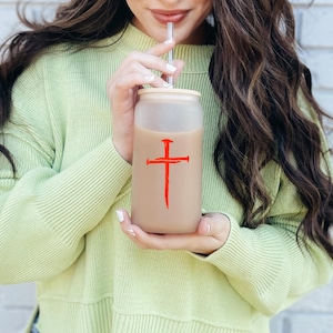 Red three nail cross vinyl decal on 16 oz glass cup, Christian faith sticker with symbolic nail cross design