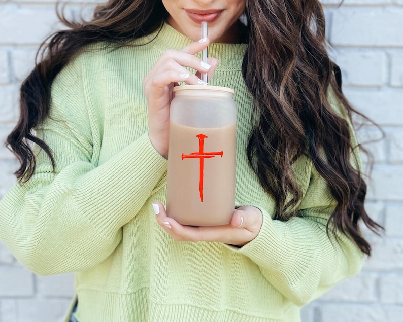 Red three nail cross vinyl decal on 16 oz glass cup, Christian faith sticker with symbolic nail cross design