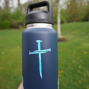 White Opal colored holographic Faith symbol vinyl decal on water bottle, Three Nail Cross religious gift