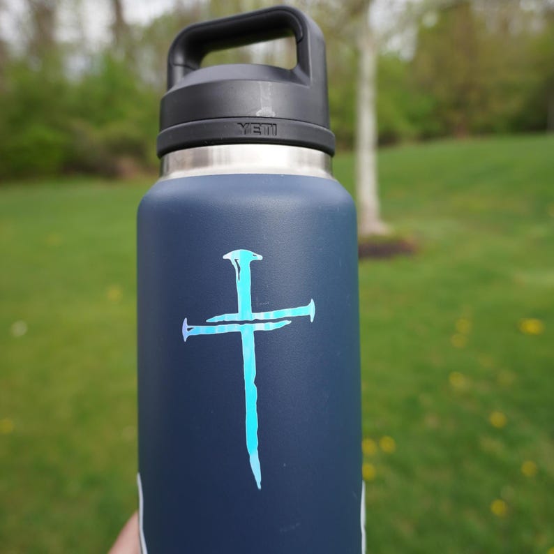 White Opal colored holographic Faith symbol vinyl decal on water bottle, Three Nail Cross religious gift