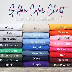 May include: A color chart for Gildan crewneck sweatshirts. The chart displays a variety of colors, including white, ash, sport gray, dark heather, Irish green, military green, forest green, black, sand, light blue, Carolina blue, royal, indigo blue, navy, purple, gold, orange, light pink, safety pink, heliconia, red, maroon, and dark chocolate.