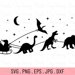 May include: Black and white silhouette of Santa Claus in a sleigh being pulled by a dinosaur, a Tyrannosaurus Rex, and a Triceratops. A pterodactyl flies above them with a crescent moon and stars in the background.