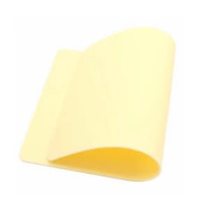 May include: A pale yellow, rectangular sheet of material, slightly curved and folded over itself. The material appears smooth and flexible, with a soft, matte finish. The sheet is against a white background.