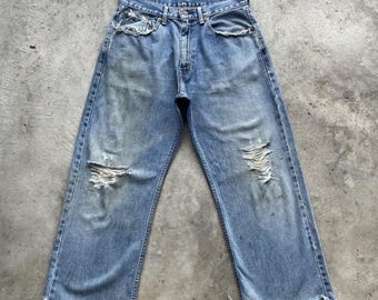 Spodnie jeansowe vintage Levi's Denim z przetarciami i wyblakłymi nogawkami, rozmiar 31x26,5