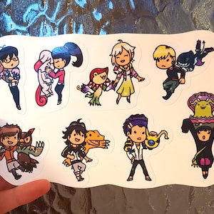 May include: A set of nine colourful stickers featuring cartoon characters with their animal companions. The characters are all wearing different outfits and have unique hairstyles. The stickers are perfect for adding a touch of whimsy to laptops, water bottles, or notebooks.