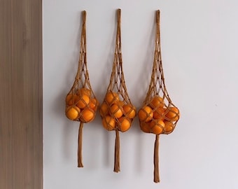 Hanging mesh fruit and vegetable basket.