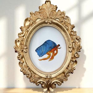 Mini Hermit Crab Watercolor • Coastal Beach Art • Small Framed Ocean Decor • Gold Ornate Oval Frame • Nautical Cottagecore Wall Art