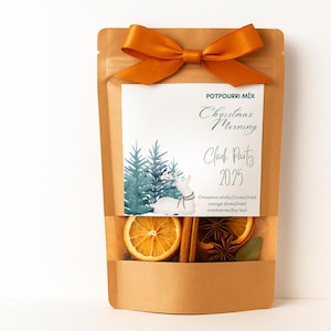 May include: A brown paper pouch containing a potpourri mix, topped with an orange ribbon bow. The label features the text POTPOURRI MIX, Christmas Morning, Clark Party 2025, and a watercolor illustration of a deer and pine trees.