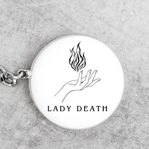 lady death on a keychain