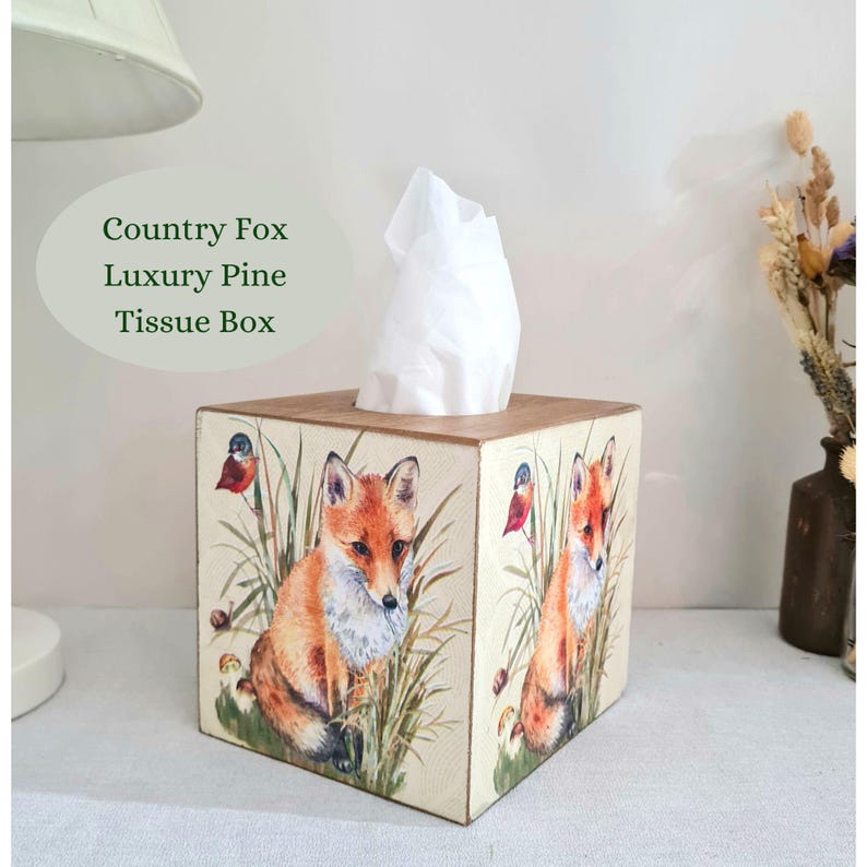 Country fox and robins luxury pine square tissue box this lovely tissue box has been primed and decoupaged in a country fox and robins design on all sides of the tissue box in a mix of greens browns reds orange cream and black with hints of gold wax gilding around the corners of the box, the top and inside the box have been waxed with a pull-out base to keep your tissues inside sealed all over to protect just wipe down with a damp cloth when needed Height 14 cm Width 15 cm Length 13 cm