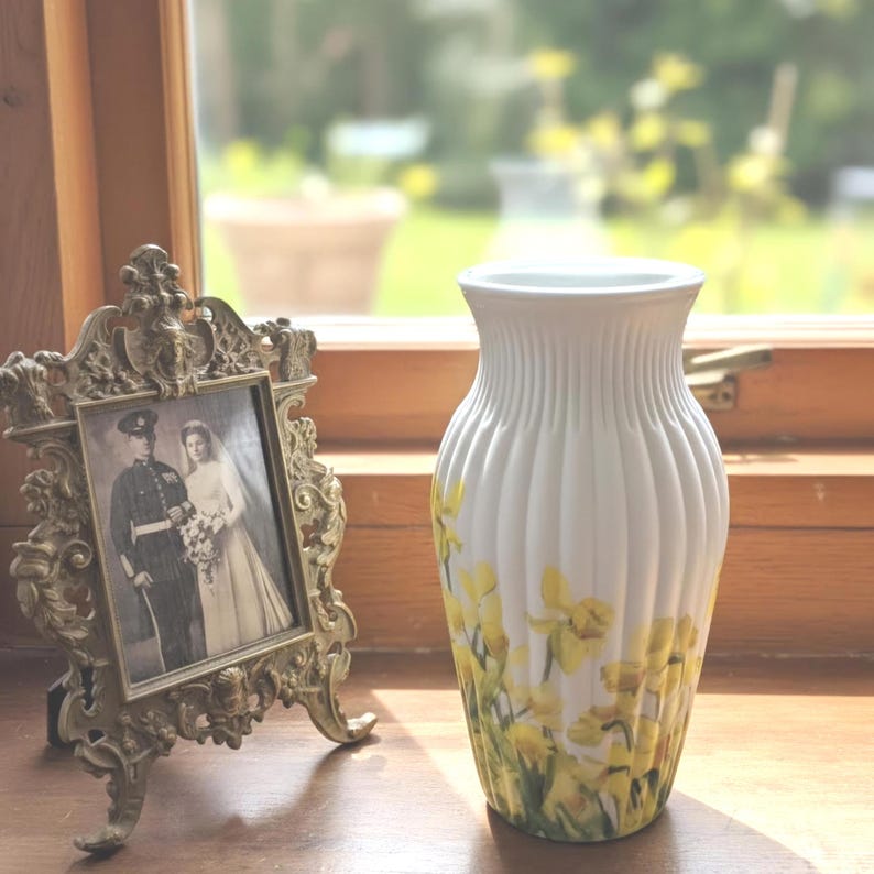 Tall large ribbed daffodil glass vase, A pretty daffodil long stemmed 26cm in height 14 cm width glass vase primed and painted in a white chalk paint providing the perfect backdrop for the decoupaged yellow daffodils all around the vase and is sure to bring a touch of nature and colour to any room