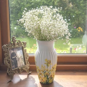 Tall large ribbed daffodil glass vase, A pretty daffodil long stemmed 26cm in height 14 cm width glass vase primed and painted in a white chalk paint providing the perfect backdrop for the decoupaged yellow daffodils all around the vase and is sure to bring a touch of nature and colour to any room