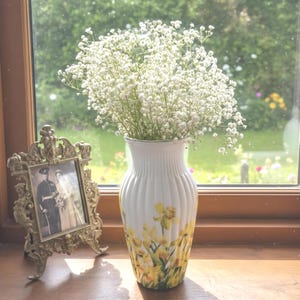 Tall large ribbed daffodil glass vase, A pretty daffodil long stemmed 26cm in height 14 cm width glass vase primed and painted in a white chalk paint providing the perfect backdrop for the decoupaged yellow daffodils all around the vase and is sure to bring a touch of nature and colour to any room