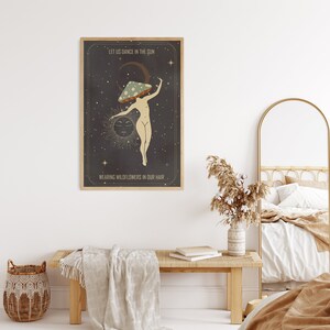 May include: A vintage-style poster with a dark background and stars. A woman with a mushroom on her head dances in front of a sun and moon. The text reads "Let us dance in the sun, wearing wildflowers in our hair."