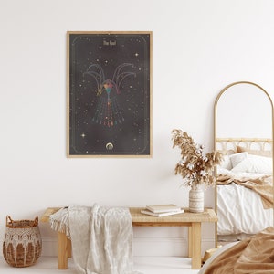 May include: A framed tarot card print with a black background and gold accents. The card depicts a stylized figure with a rainbow-colored design and the text "The Fool".