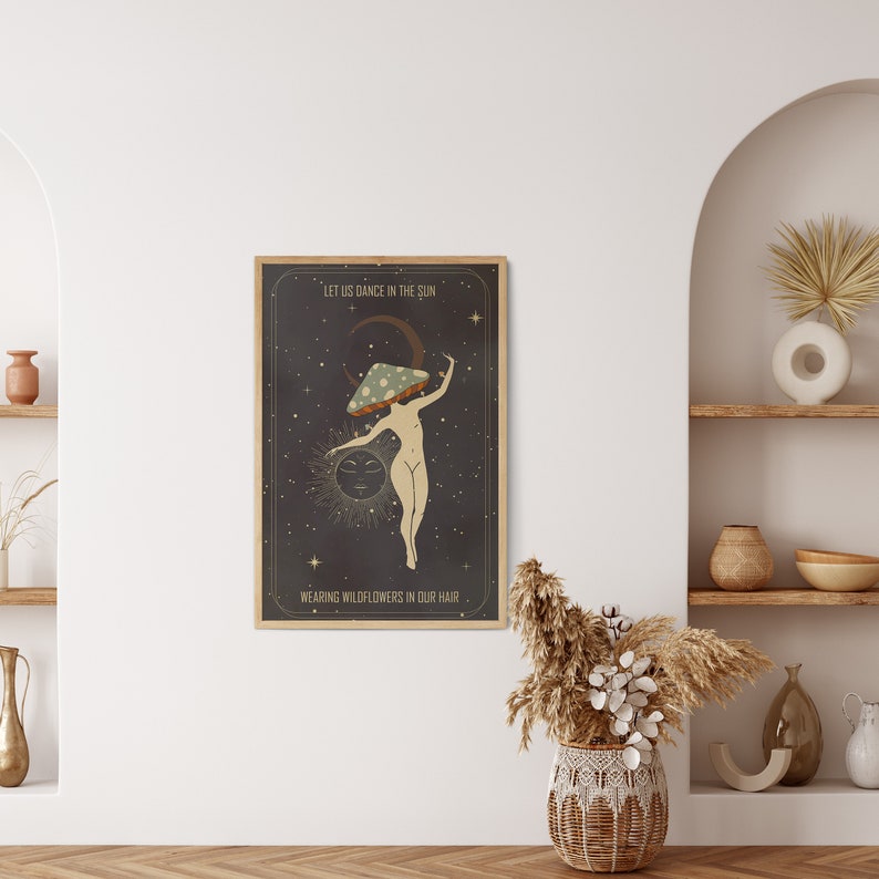 May include: A vintage-style poster with a dark background and a woman with a mushroom on her head dancing in front of a crescent moon and sun. The text on the poster reads "Let us dance in the sun, wearing wildflowers in our hair."