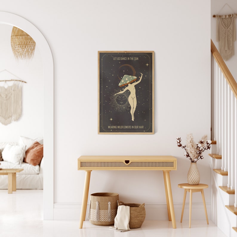 May include: A black and white poster with a woman dancing in the center. She is wearing a mushroom on her head and has a crescent moon behind her. The text on the poster reads "Let us dance in the sun, wearing wildflowers in our hair."