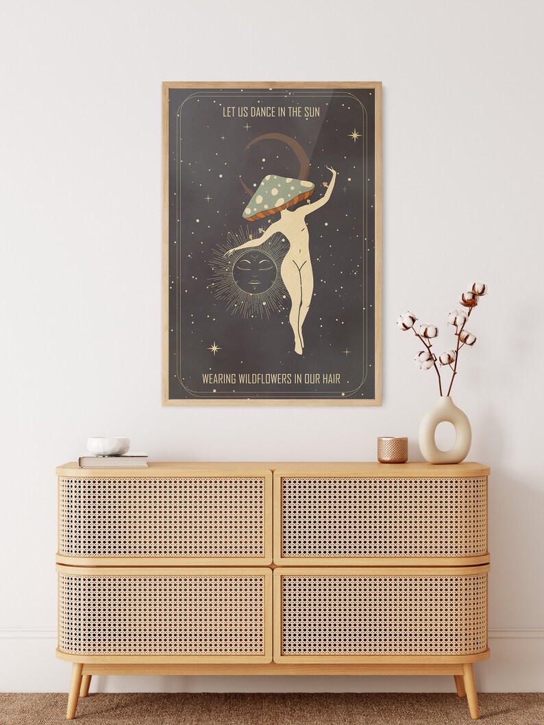 May include: A vintage-style poster with a dark background and stars. A woman with a mushroom on her head dances in front of a sun and moon. The text reads "Let us dance in the sun wearing wildflowers in our hair."