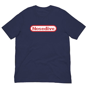 May include: A navy blue t-shirt with a red and white Nintendo-style graphic that says "Nosedive".