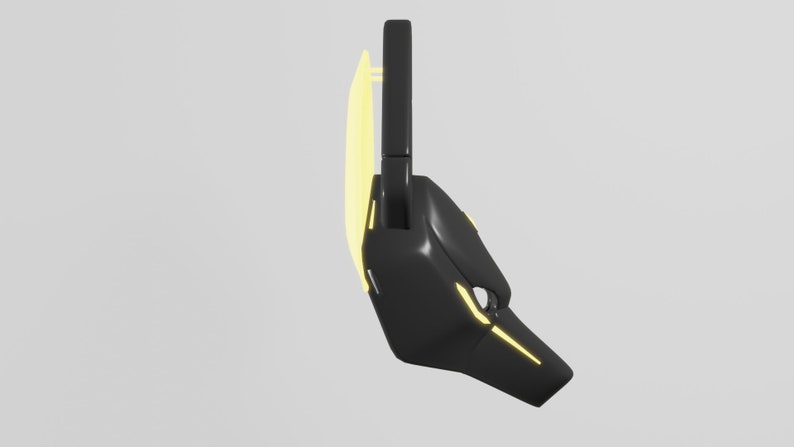 May include: A black and yellow futuristic mask with a geometric design. The mask has a curved shape and a pointed nose.