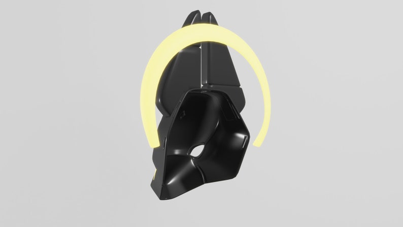 May include: A black, geometric, 3D printed object with a yellow halo around it. The object is shaped like a helmet or a mask.