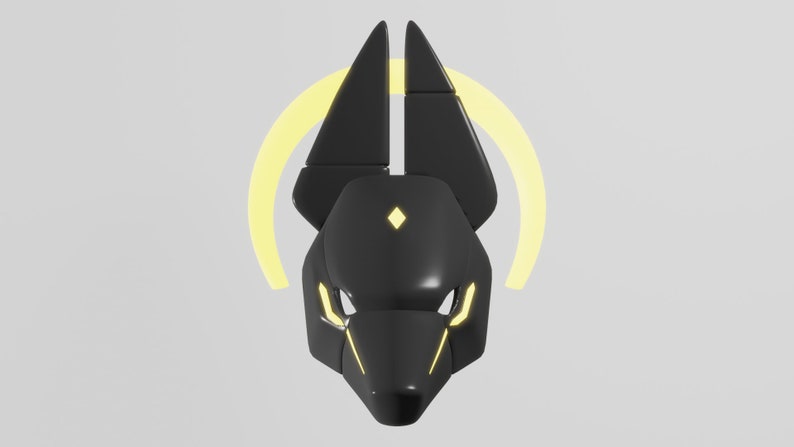 May include: A black and yellow stylized mask with a geometric design. The mask has a pointed snout and two large ears. The mask is surrounded by a yellow halo.
