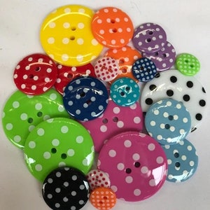 May include: Assortment of colourful polka dot buttons in various sizes and colours, including red, yellow, green, blue, pink, and black.