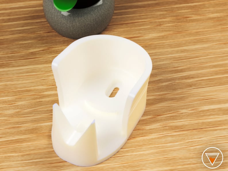 May include: White plastic holder for a roll of tape. The holder has a slot for the tape roll and a small hole for the tape to feed through.